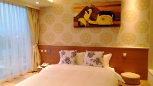 Letto o letti in una camera di Walker Hotel. Ximen