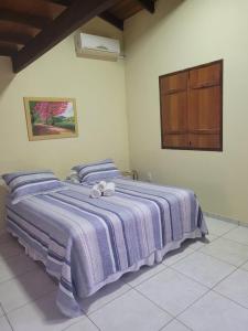 Brisa da Serra Hotel Pousada Pirenopolis客房内的一张或多张床位