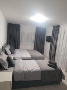 Postel nebo postele na pokoji v ubytování GREY VILLAS