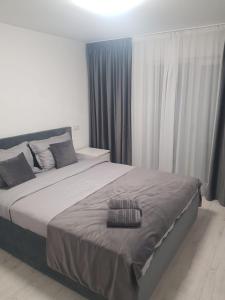 Postel nebo postele na pokoji v ubytování GREY VILLAS