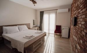 Postel nebo postele na pokoji v ubytování Harakop Otel