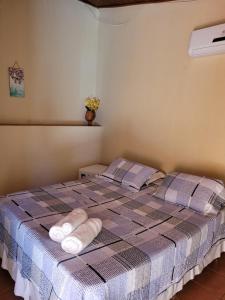 Brisa da Serra Hotel Pousada Pirenopolis客房内的一张或多张床位