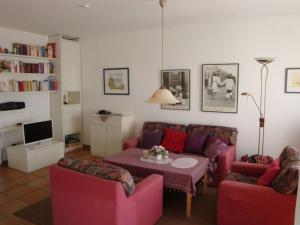 a living room with a couch and a table at Nice holiday home near town centre in Juist