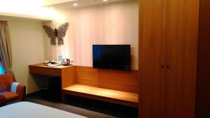 TV o dispositivi per l'intrattenimento presso Walker Hotel. Ximen