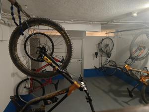 a bike on a bike rack in a garage at Hotel Villa Chiara in Finale Ligure