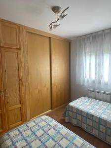 Una cama o camas en una habitación de Apartamento en Carreña de Cabrales