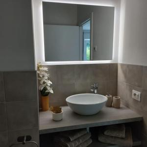 a bathroom with a sink and a mirror at Casa Fornace in Ala