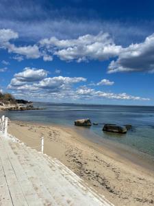 a beach with two large rocks in the water at Magnifica La Mer in Golden Sands