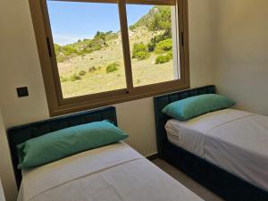 Tempat tidur dalam kamar di Good Life Yellow and Ocean Holiday Apartments