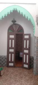 an open door to a room with a bedroom at My house in Rabat
