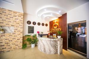 a coffee shop with a counter in a building at CHERRY HOTEL in Da Lat
