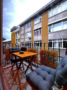 a patio with a table and chairs and a building at Dimora Hotel Kadıköy in Istanbul