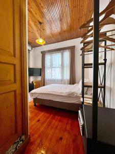a bedroom with a bunk bed and a wooden ceiling at Dimora Hotel Kadıköy in Istanbul