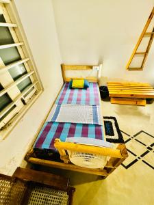 a bedroom with a bed in a room at Madiha Hostel by Land of Rizka in Matara