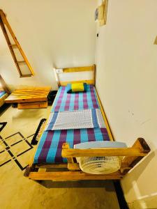 a bedroom with two beds in a room at Madiha Hostel by Land of Rizka in Matara