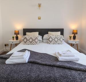 En eller flere senge i et værelse på Sea view retreat