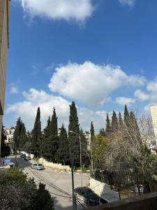 a view of a street with a bunch of trees at New Apartment in Nablus City in Mashabbe Sade