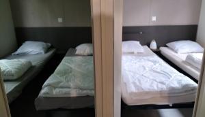 Postel nebo postele na pokoji v ubytování Mobil home Côte d'Opale