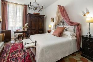 Postel nebo postele na pokoji v ubytování Abbadia San Giorgio