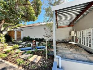 a backyard with a fire hydrant in front of a house at Ladamon 3 in Paarl