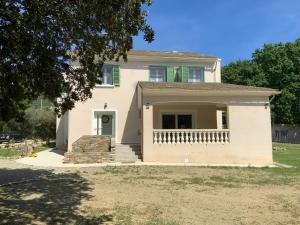 a large white house with a porch at U FARNIENTE in Patrimonio
