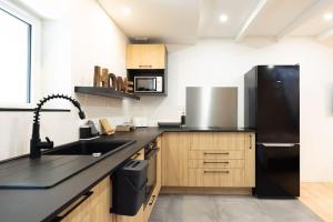 Η κουζίνα ή μικρή κουζίνα στο Grand T2 cosy proche Futuroscope +7 φωτογραφίες