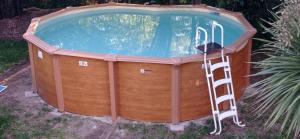 a hot tub with a ladder next to it at Maison au calme avec jardin et piscine Saint Raphaël in Saint-Raphaël