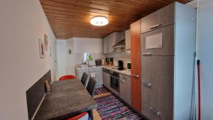 Kuchyň nebo kuchyňský kout v ubytování homy Bludenz Downtown Suites