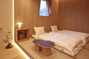 Postel nebo postele na pokoji v ubytování PBr7 Hotel Unusual Stay