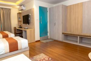 Ένα ή περισσότερα κρεβάτια σε δωμάτιο στο Hotel Badrinath