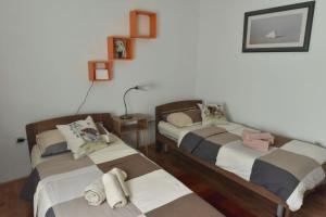 Postel nebo postele na pokoji v ubytování Apartmani Reset