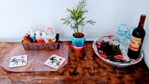 a table with a bottle of wine and playing cards at Casa Muskoka in Zurgena +18 photos