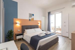 Postel nebo postele na pokoji v ubytování Quarzo Modern Rooms