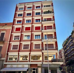 a tall building with windows and balconies on it at Dadu 150 in Bari