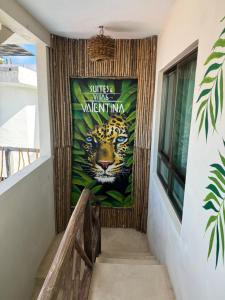 a mural of a tiger on a wall at Suites Valentina in Puerto Morelos