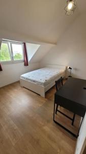 Ένα ή περισσότερα κρεβάτια σε δωμάτιο στο Charmante maison 3 Chambres avec Terrasse