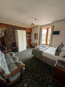 Postel nebo postele na pokoji v ubytování St Olaf Golf Hotel