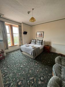 Postel nebo postele na pokoji v ubytování St Olaf Golf Hotel