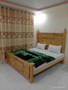 Ένα ή περισσότερα κρεβάτια σε δωμάτιο στο New White Palace Hotel