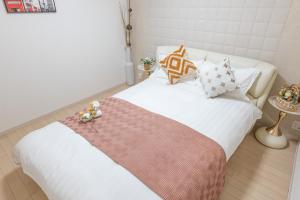 Una cama o camas en una habitación de 1 池袋駅 5分 2-8人丨Ikebukuro 5 minutes 2-8 people