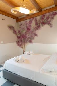 Posteľ alebo postele v izbe v ubytovaní La Corte dell’Isola