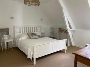 Кровать или кровати в номере La petite maison