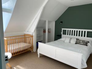Кровать или кровати в номере La petite maison
