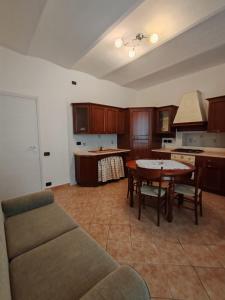 a living room with a couch and a table at Aria Pura in Monforte dʼAlba +15 photos