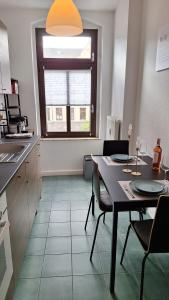 Kuchyň nebo kuchyňský kout v ubytování Stylisches Appartement im Jugendstil-Viertel + 13 fotografií