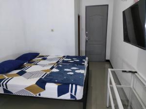Postel nebo postele na pokoji v ubytování Hotel Residence 5 Syariah + 13 fotografií