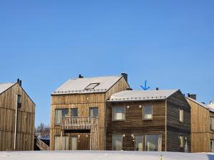 a house with a metal roof on top of it at Kirkenes Interlake in Kirkenes