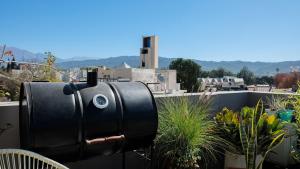 a black mailbox on the side of a balcony at CASA MARGARITA 4Piso MonoAmarillo in San Salvador de Jujuy