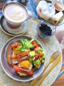 a plate of food with a salad and a cup of coffee at Gasthof Oberschmiede in Auf der Wiese