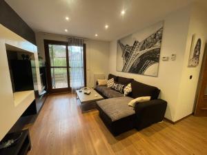 a living room with a couch and a table at Casa Mati in Sorripas